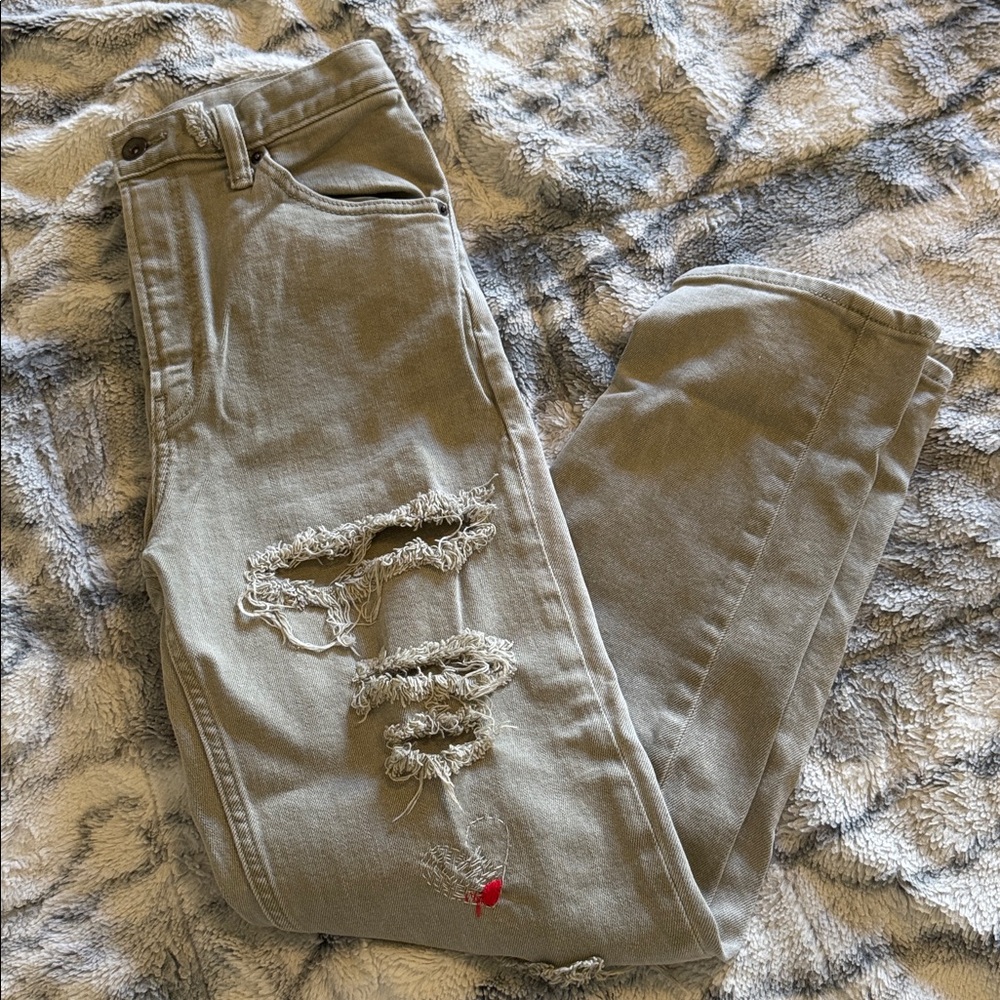 Green/grey ripped jeans